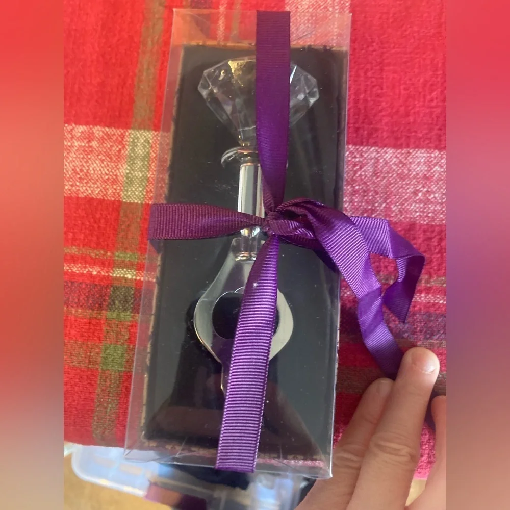 Faux diamond bottle opener. New in box. Super cute & Would make a great gift